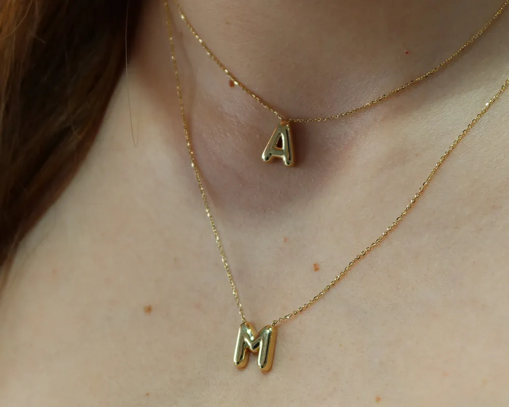 Initial & Name Jewelry Personalized pieces that celebrate identity, from bold, ready-to-gift initials to custom diamond initial rings or name design necklaces. Moore Jewelers Laredo, TX