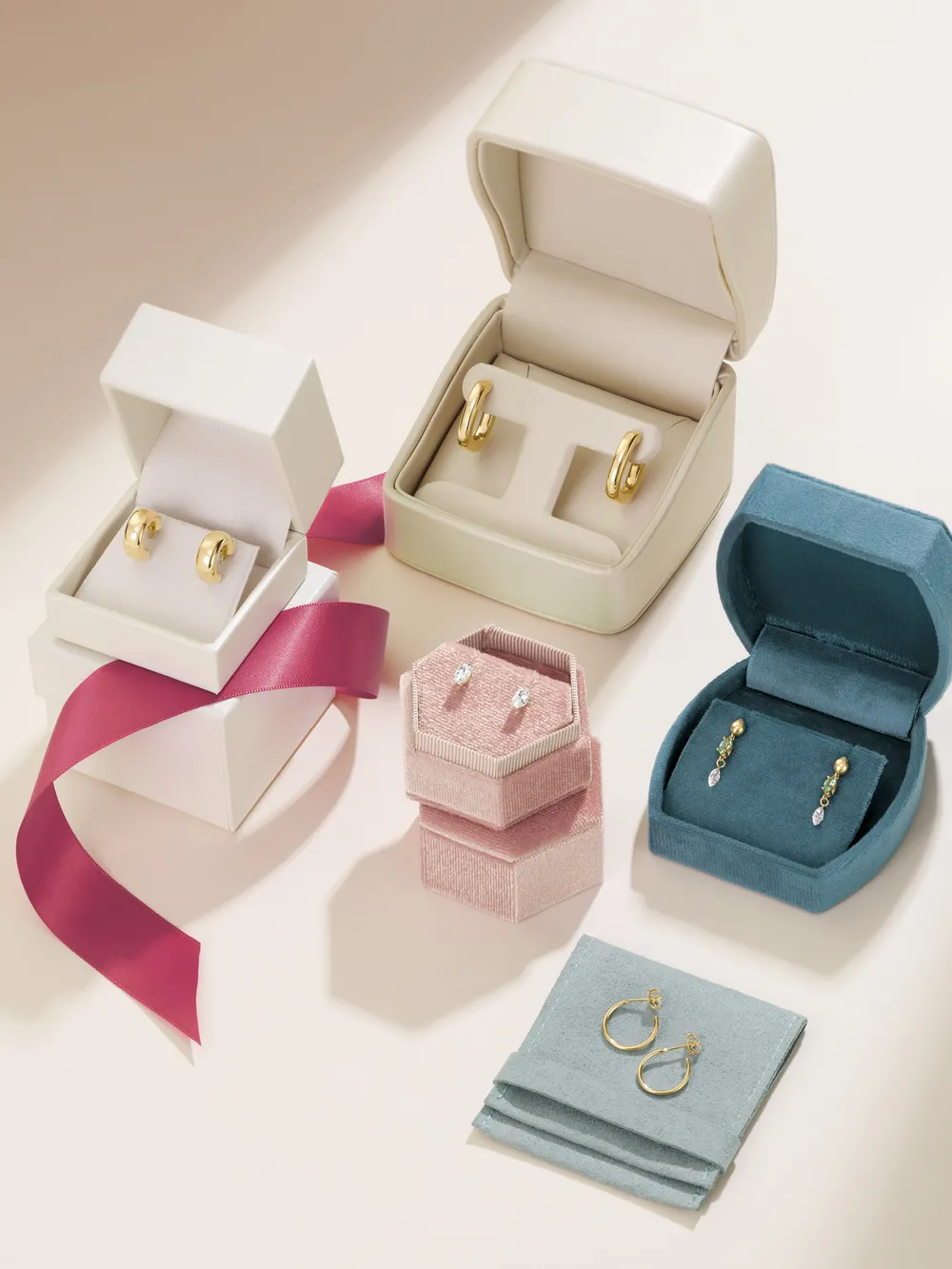 Gold and gemstone earrings in gift boxes with a satin ribbon at Morin Jewelers, Southbridge, MA