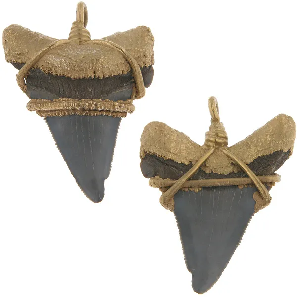 custom mountings We have customers who have special requests for mountings for odd-shaped items or stones, such as a shark's tooth. We created a custom wire mounting to make this tooth into a pendant as well as added gold accents. Morrison Smith Jewelers Charlotte, NC