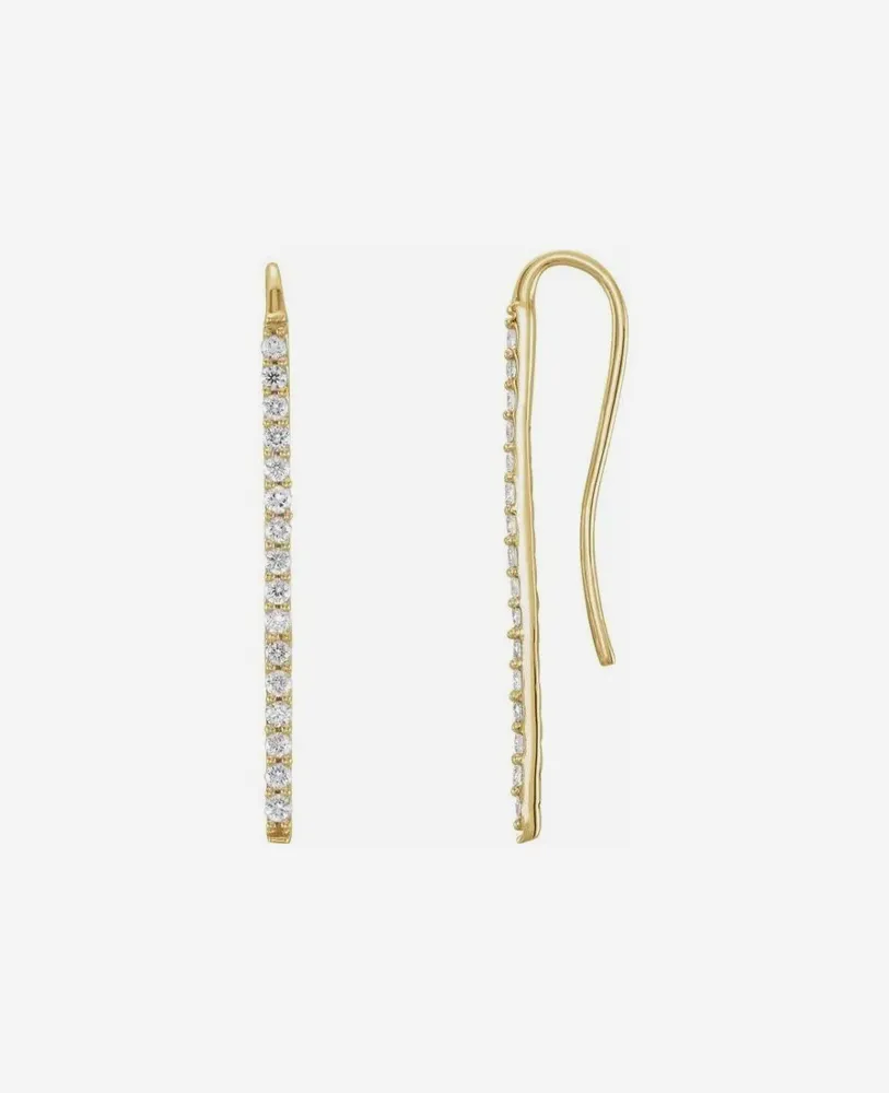 Gold earrings with a linear design and sparkling stones, showcasing elegance and style.