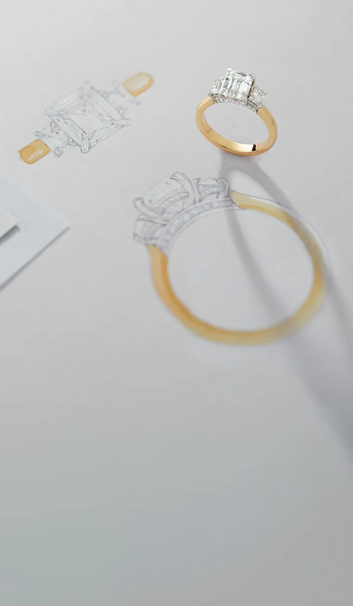 Sketches of engagement rings with a gold ring featuring an emerald-cut diamond.