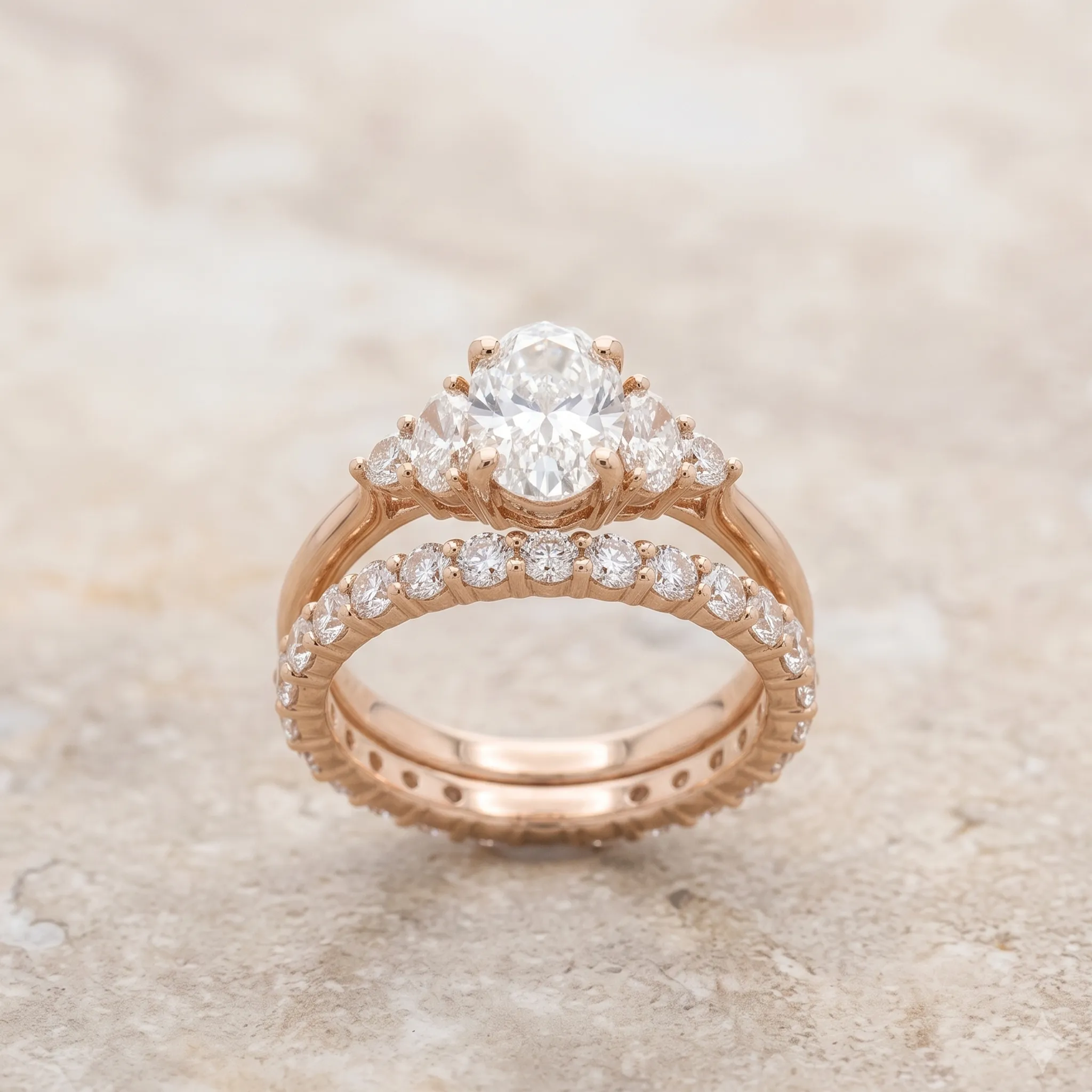 A three-stone engagement ring with a princess-cut center diamond. Explore more at Pearce Jewelers.