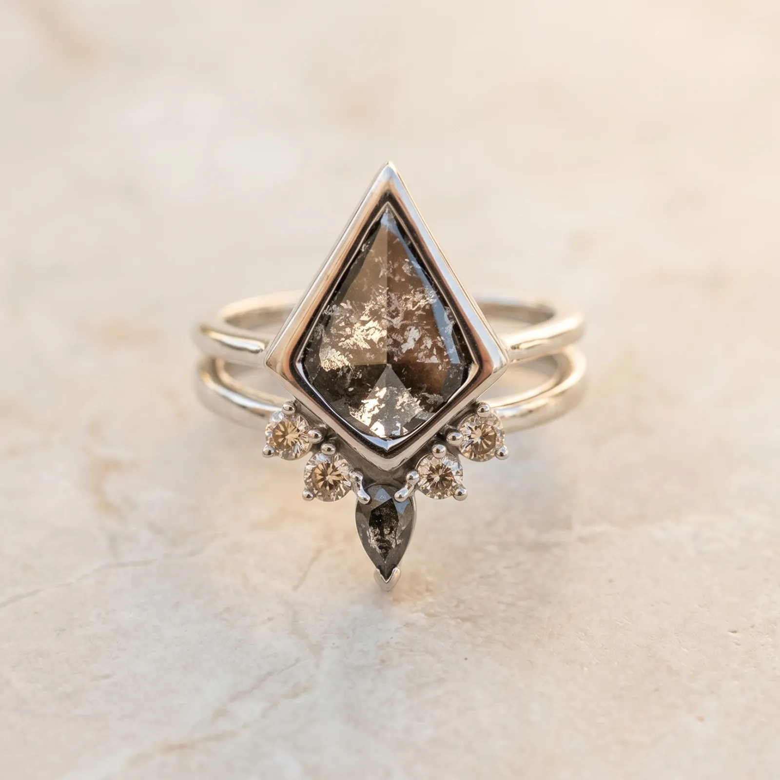 Unique diamond-shaped ring with intricate details on a light background.