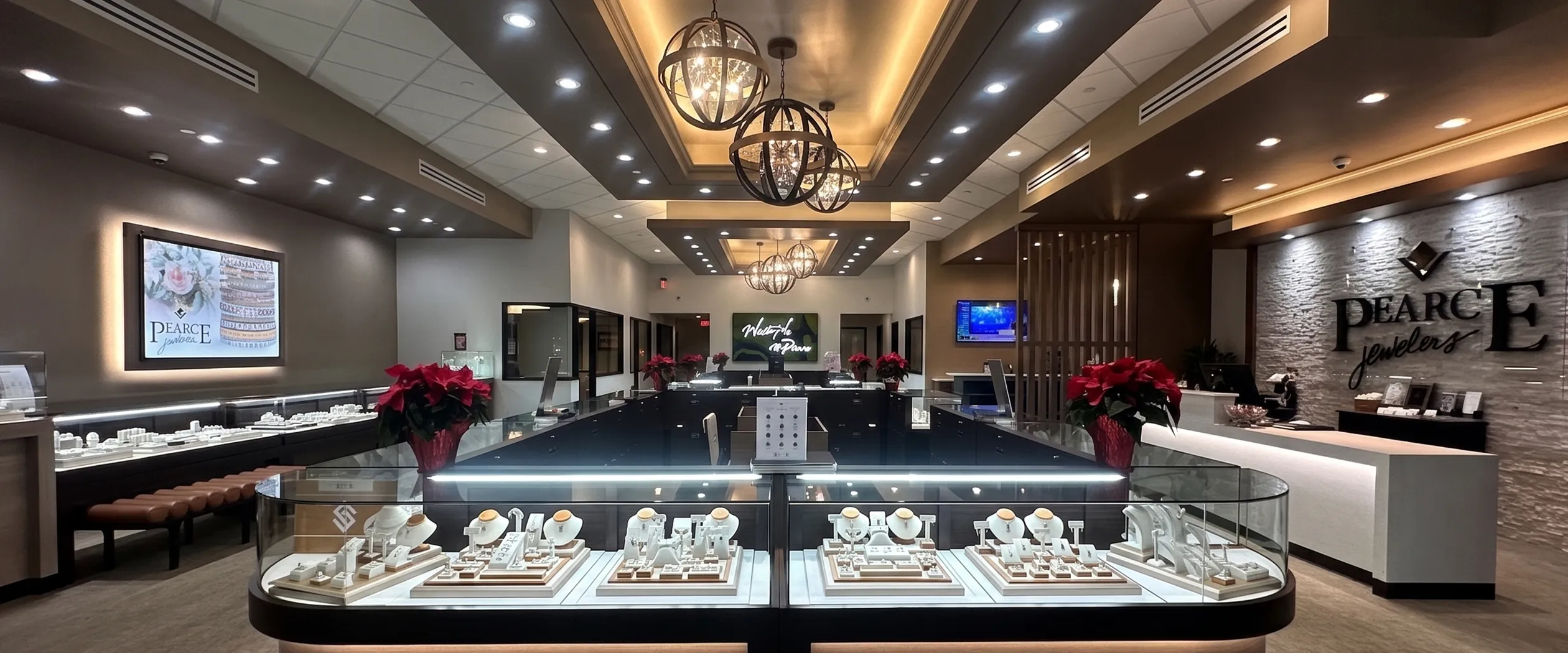 Elegant interior of Pearce Jewelers, West Lebanon, showcasing fine jewelry displays and modern lighting.