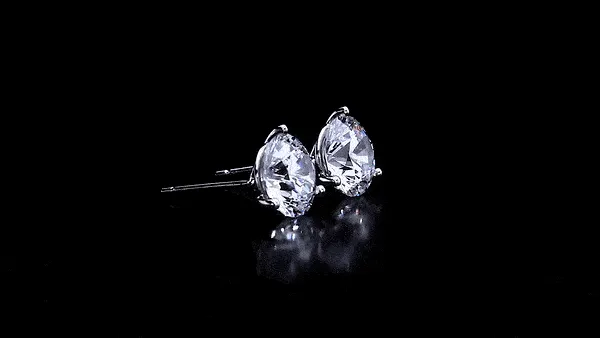 Elevate your style with diamond stud earrings that sparkle and shine. These timeless earrings are a must-have accessory for any 