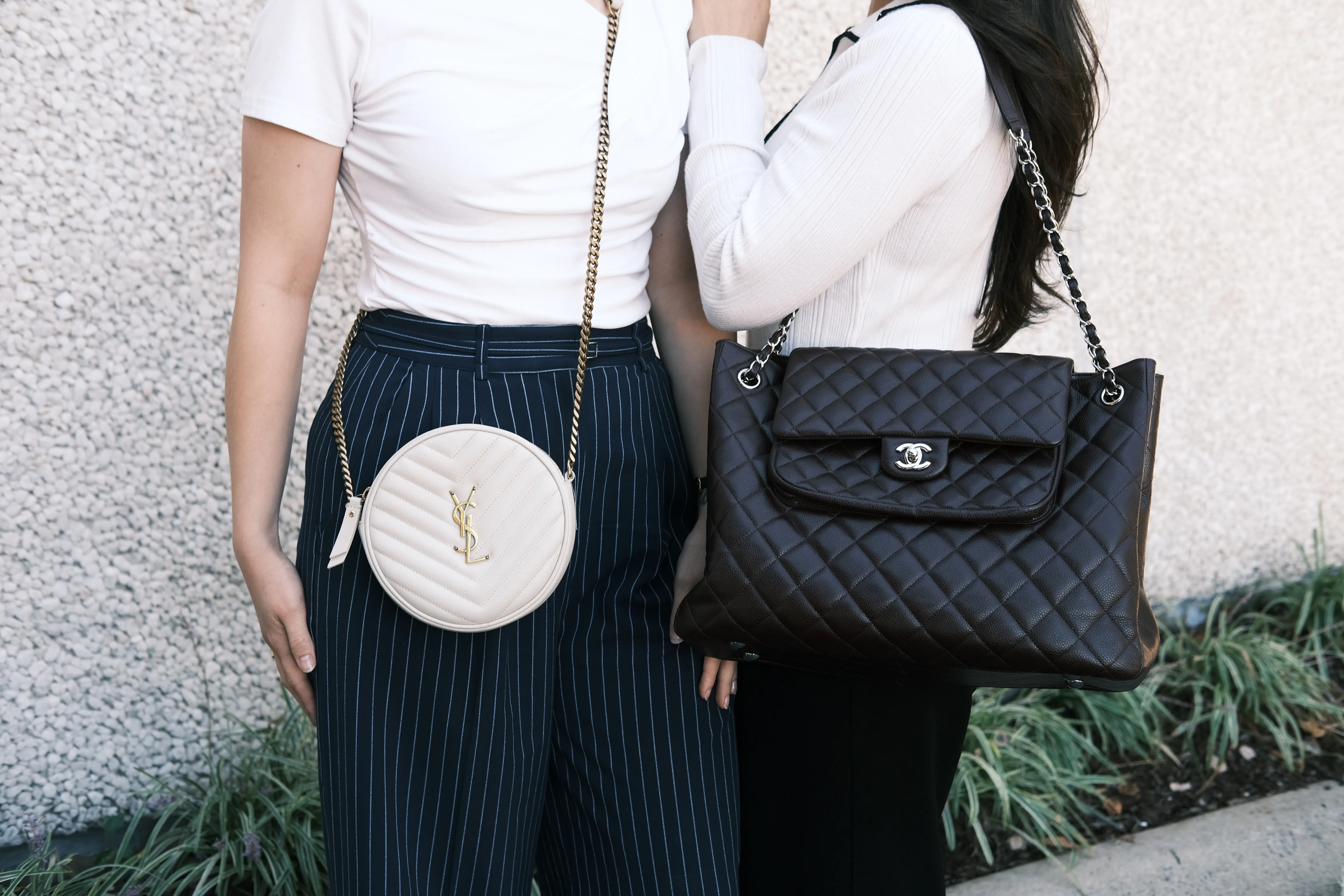 Pre-owned designer handbags at Perry’s in Charlotte, NC: a monogram top-handle bag, a checkered canvas tote, a crossbody, a black wallet and a red quilted chain bag