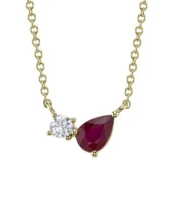 pear shape ruby and round diamond in a moi et toi necklace design. Peter & Co. Jewelers Avon Lake, OH