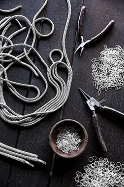 Tools for Binding John Hardy Necklaces on Table.