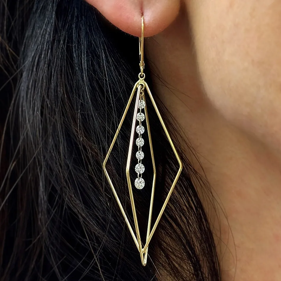 Gold and diamond earrings displayed elegantly.