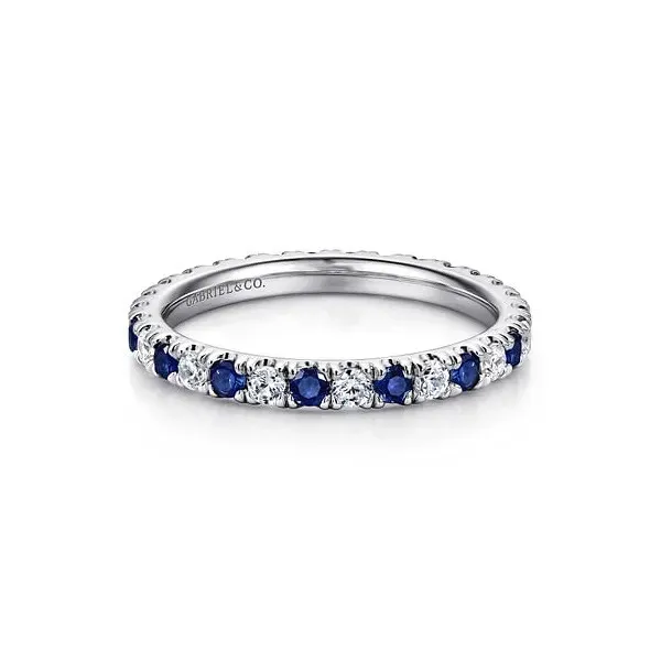Sapphire and diamond eternity band ring from Quest Fine Jewelers, Fairfax. Perfect for engagement or anniversary.