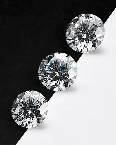 Multiple diamond rings stacked on one another | Diamond Fashion Rings available at Raleigh Diamond Fine Jewelry Raleigh, NC