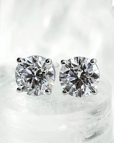 Small diamond hoop earrings hanging | Diamond Earrings available at Raleigh Diamond Fine Jewelry Raleigh, NC