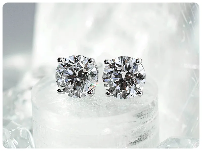 Upside down diamond shining on gray background | Mined Natural Diamonds available at Raleigh Diamond Fine Jewelry Raleigh, NC