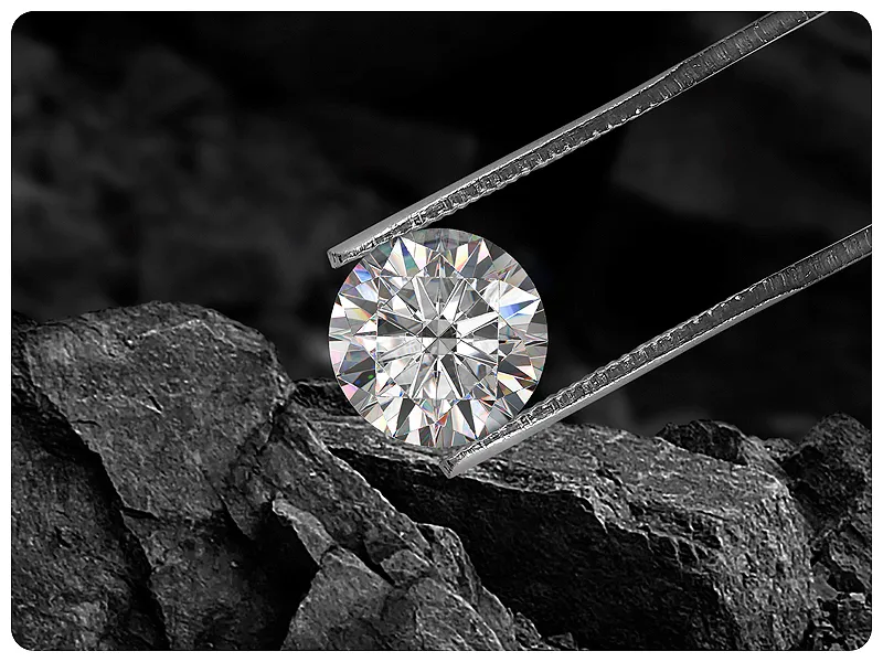 Upside down diamond shining on gray background | Mined Natural Diamonds available at Raleigh Diamond Fine Jewelry Raleigh, NC
