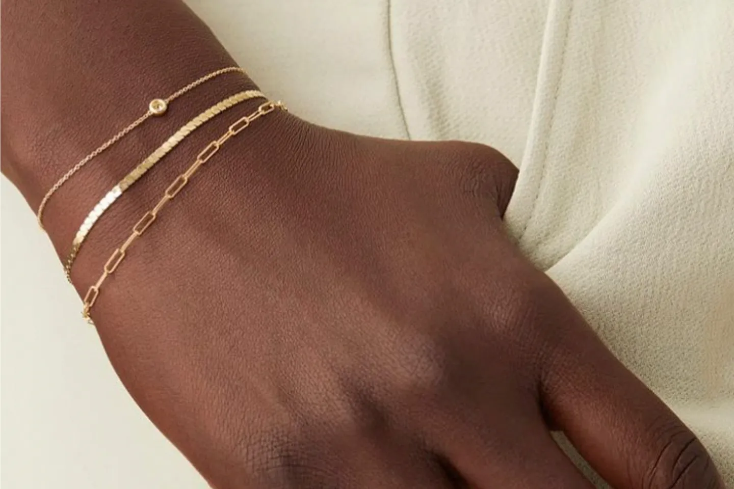 Model wearing permanent bracelets