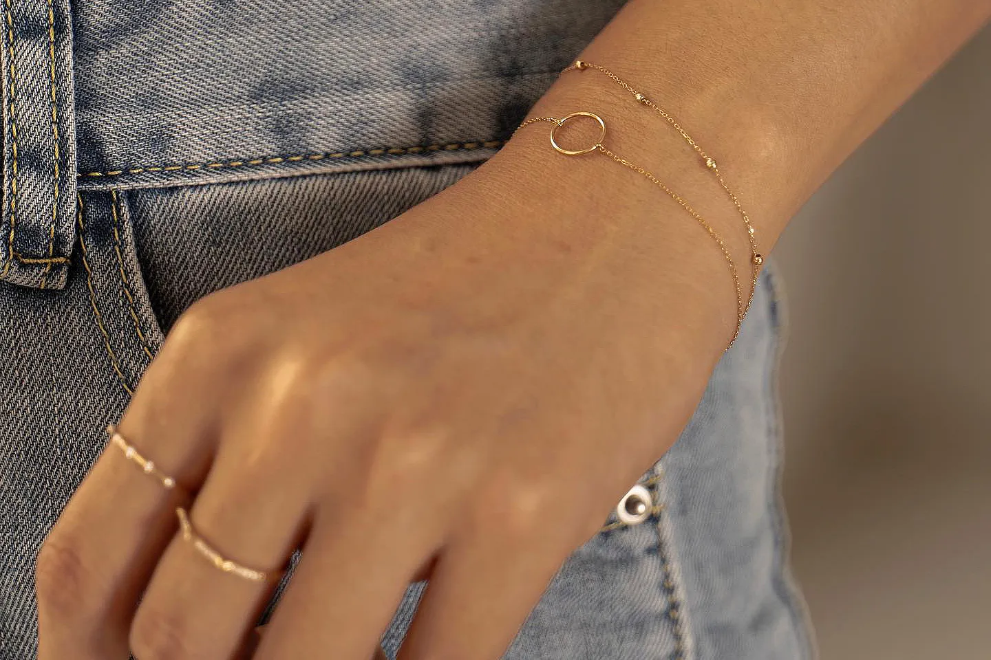 Model wearing Gold Permanent Bracelets