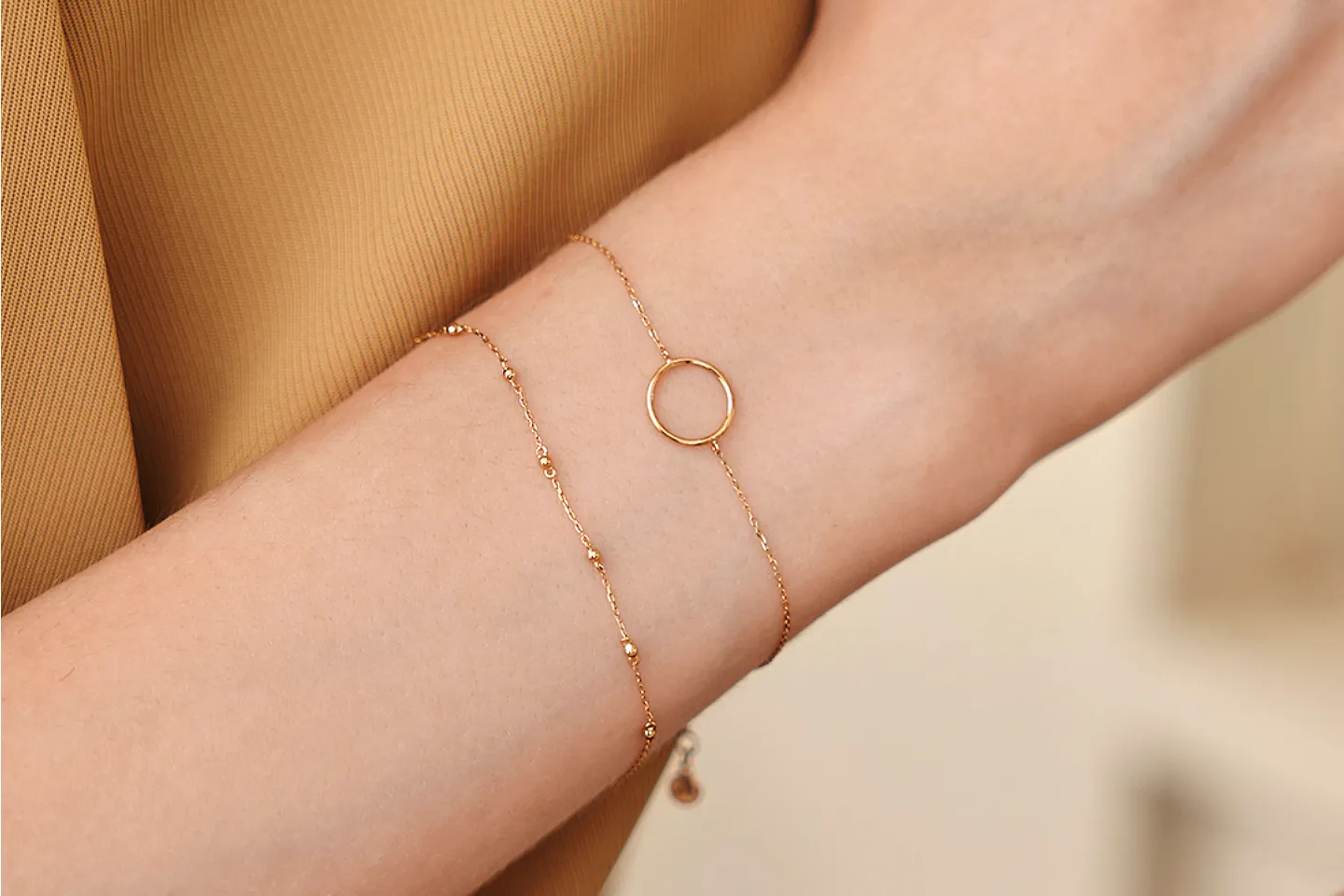 Model wearing permanent bracelets