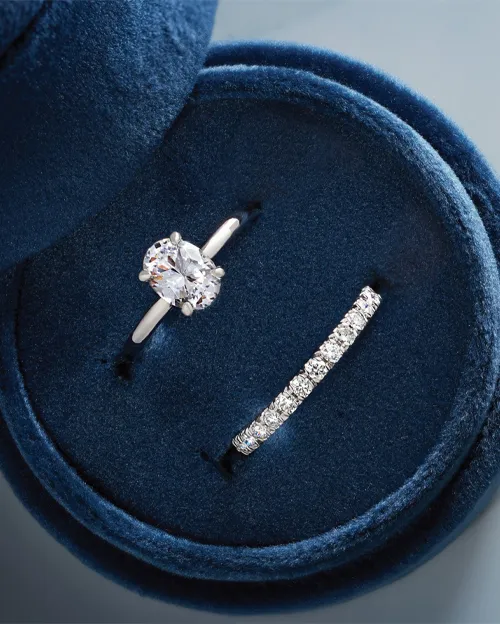 Diamond ring with diamond band in a blue jewelry box | Jewelry Design available at Raleigh Diamond Fine Jewelry Raleigh, NC