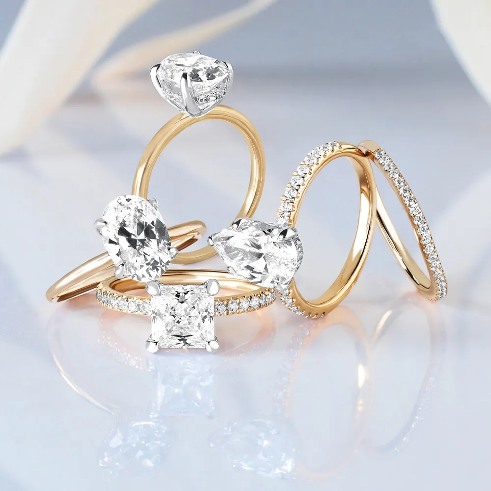Elegant collection of diamond engagement rings in gold settings. Click to shop bridal jewelry at Reiniger Jewelers.