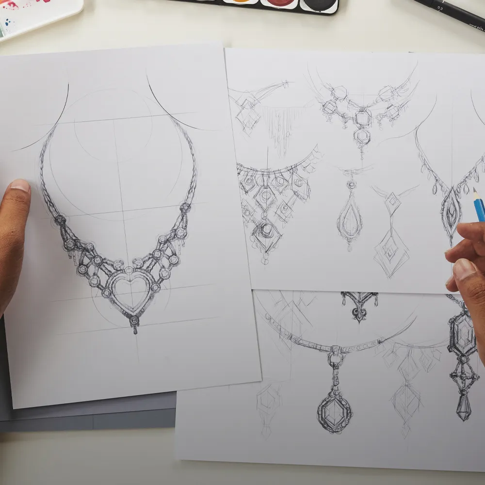 Sketches of intricate jewelry designs, including necklaces and pendants, with a hand holding a pencil.