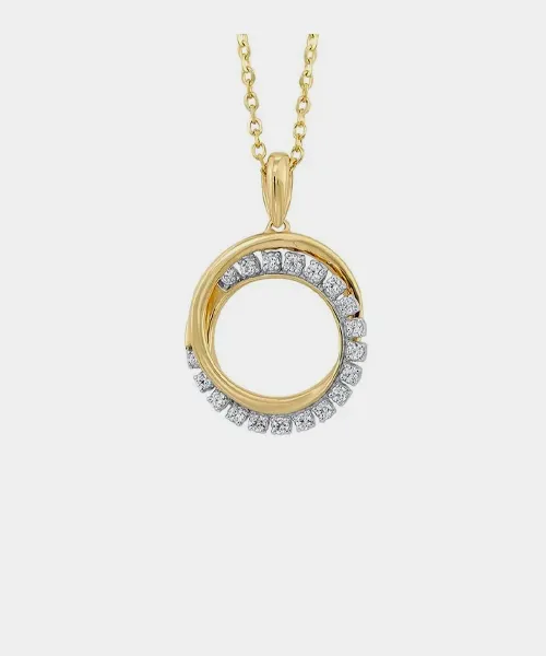 Gold pendant necklace with circular design and diamond accents, displayed for Reiniger Jewelers.