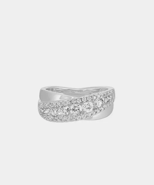 Elegant silver wedding band with sparkling diamonds, perfect for engagements or special occasions. Visit Reiniger Jewelers.