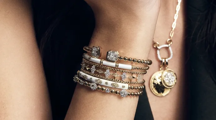 Stacked diamond and gold bracelets. Shop Renzo's Picks at Renzo & Co. in Charlotte, NC