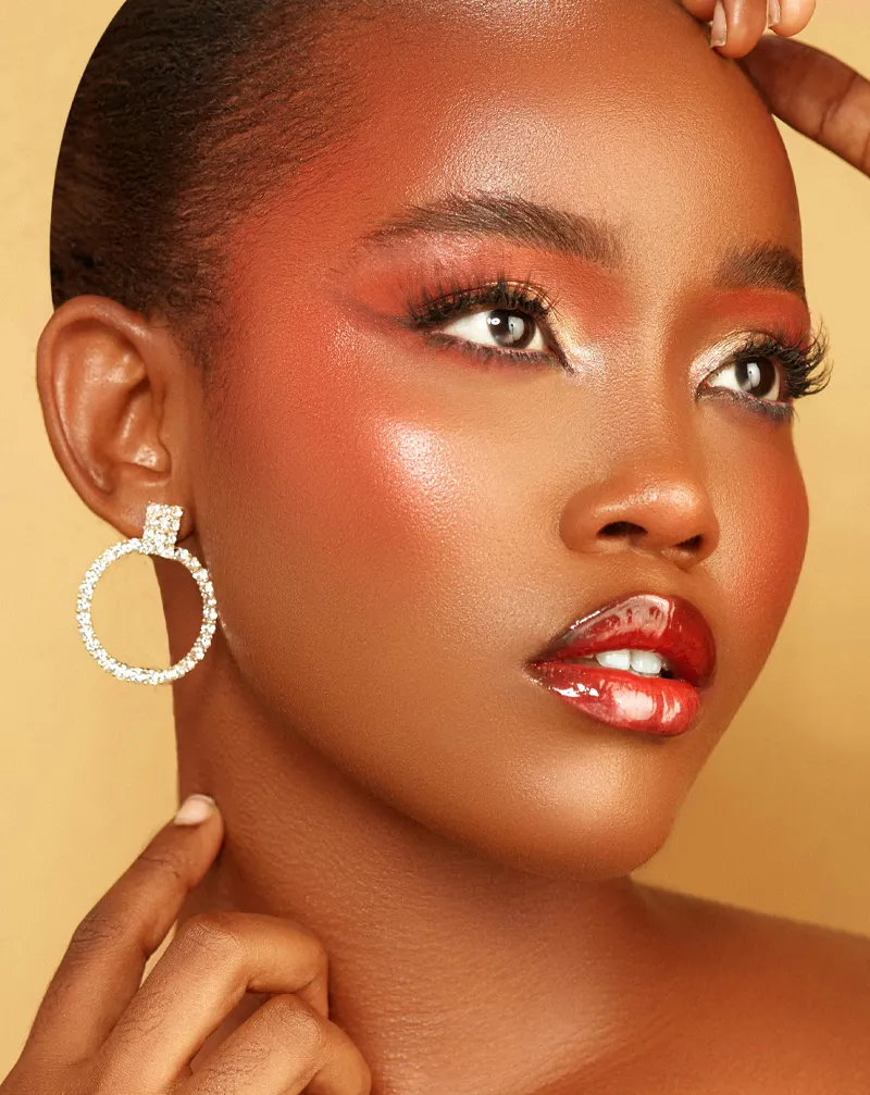 Woman looking to the right showcase a diamond hoop earring