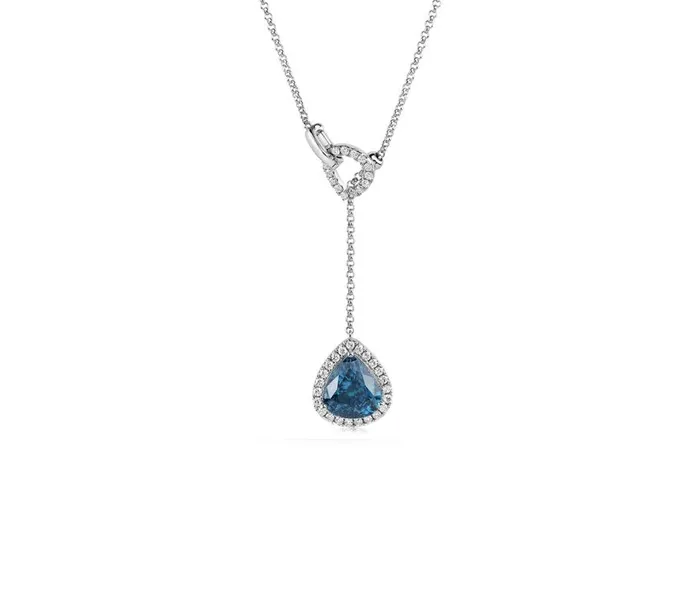 Teardrop blue gemstone pendant necklace with diamond accents.