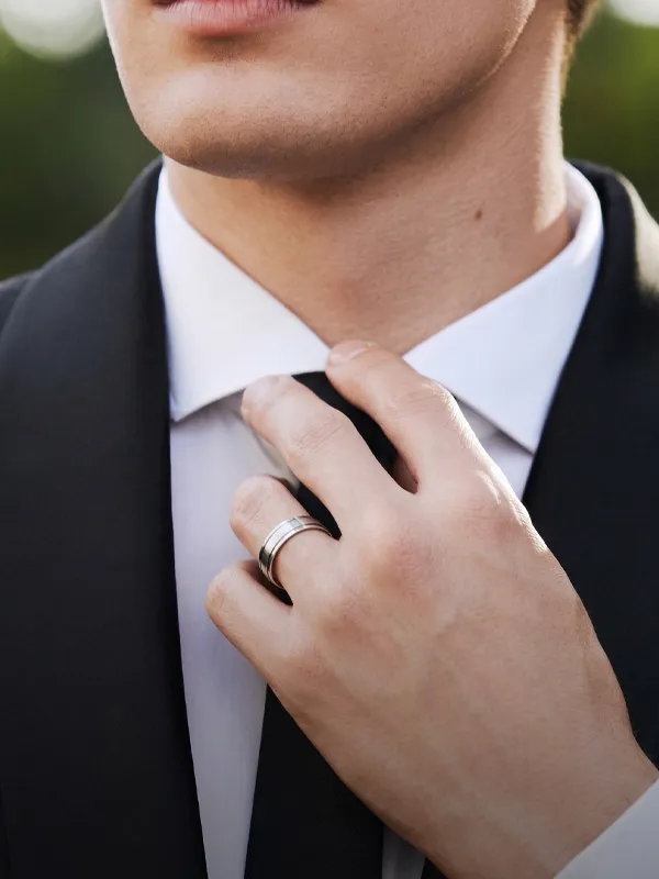 Stylish gold and silver wedding bands stacked together, available at R. Gregory Jewelers.