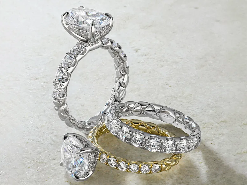 Three elegant diamond rings in silver and gold, showcasing intricate designs. Click to explore more diamonds at R. Gregory Jewel