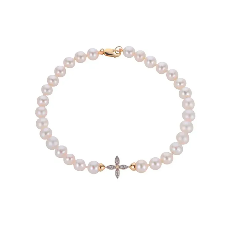 Elegant pearl bracelet with a diamond cross centerpiece.