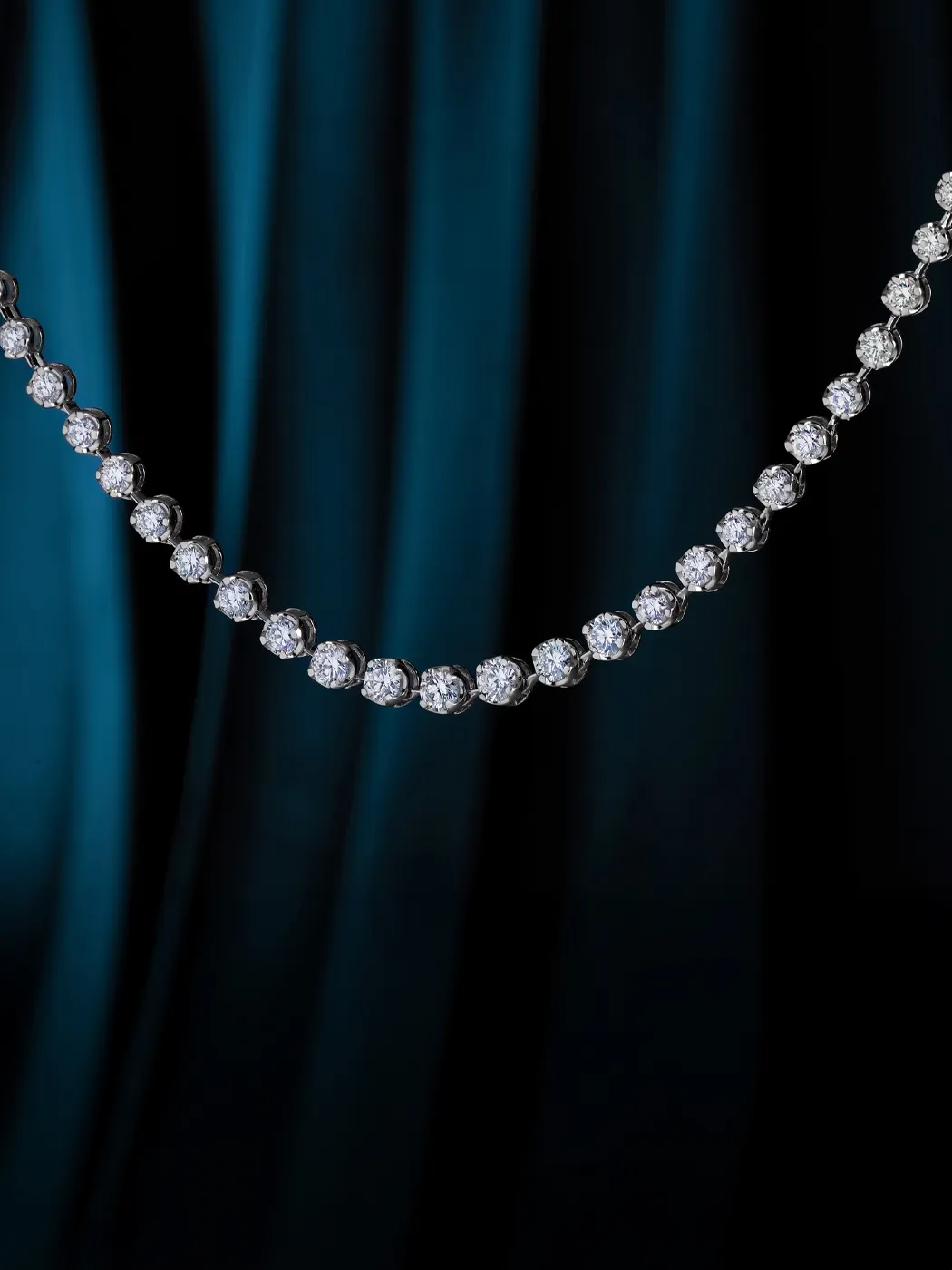 Elegant diamond necklace displayed against a dark blue backdrop.