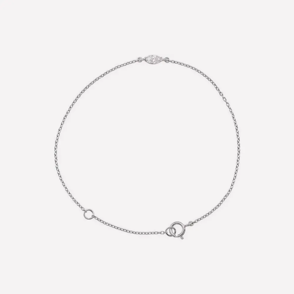 Delicate silver bracelet with a small diamond accent and clasp. Click to explore more bracelets.