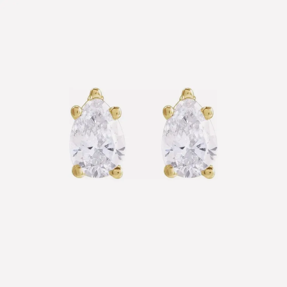 Pear-shaped diamond stud earrings with gold prongs. Click to view Diamond Studs.