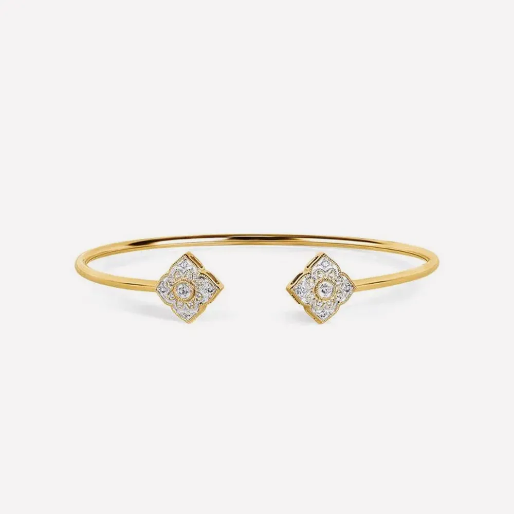 Gold bracelet with diamond-accented square ends. Click to explore bracelets.