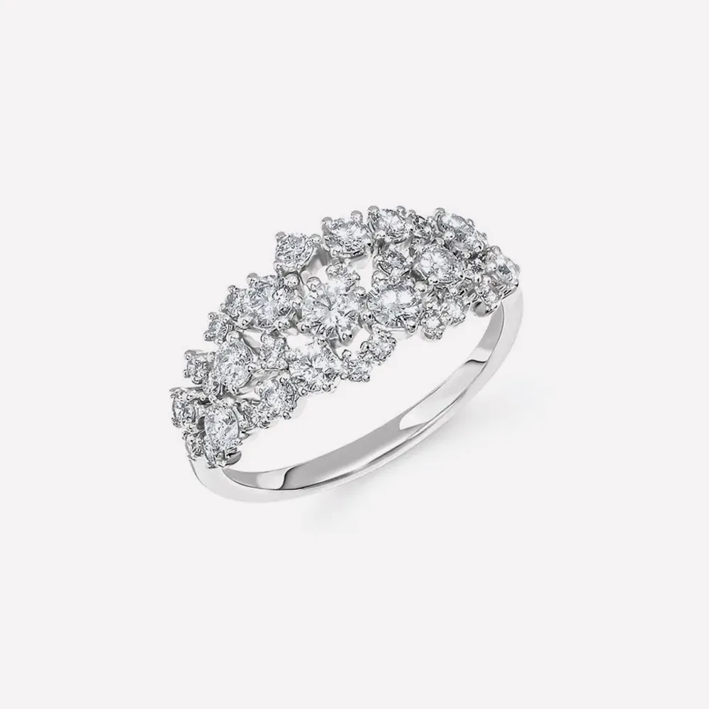 Elegant silver ring with sparkling diamond clusters. Explore more rings.