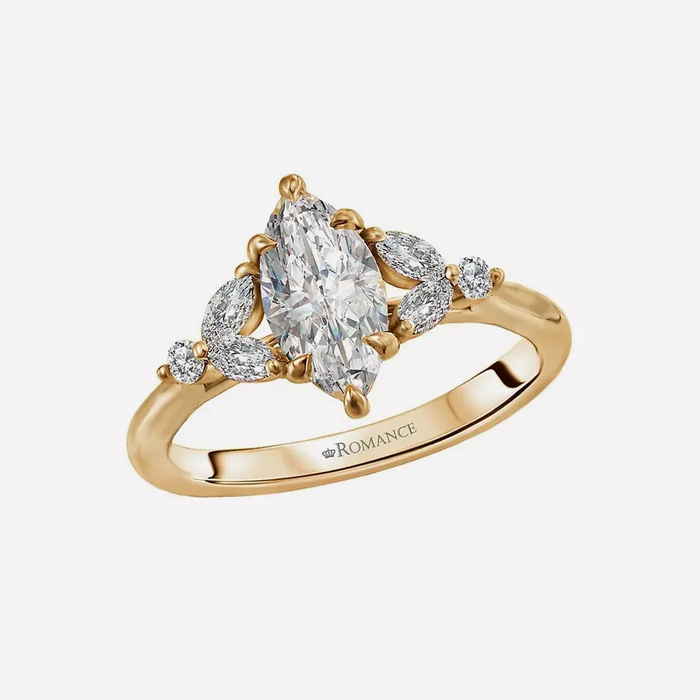 Gold ring with marquise diamond and side stones.