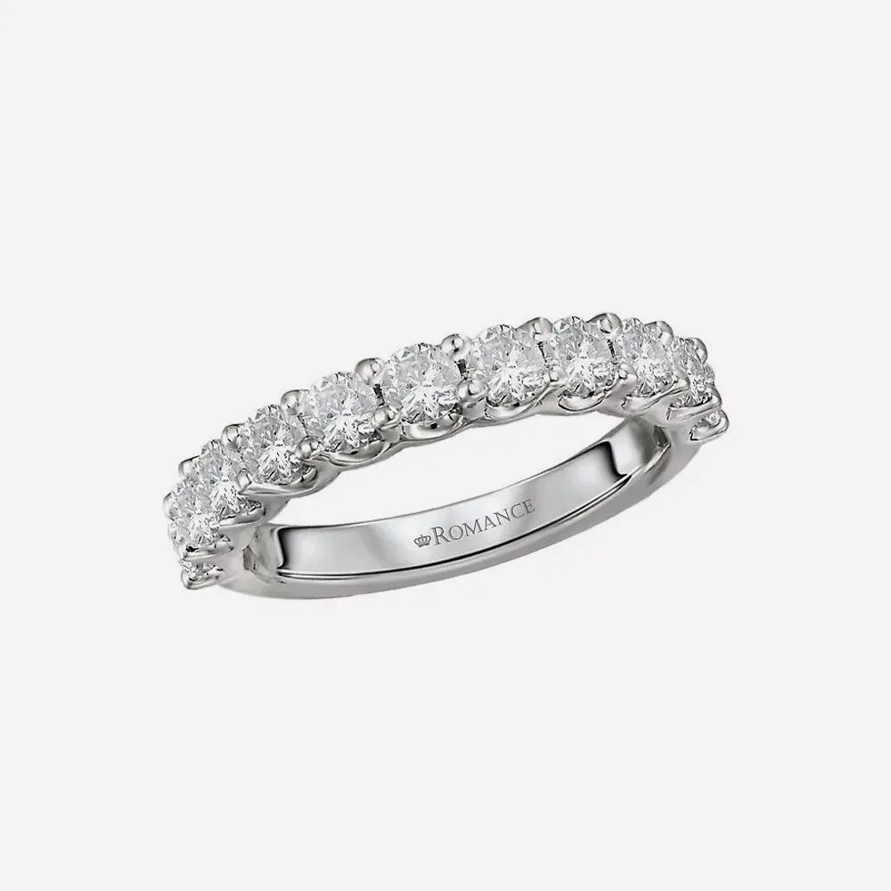 Diamond wedding band with round stones on a silver band.