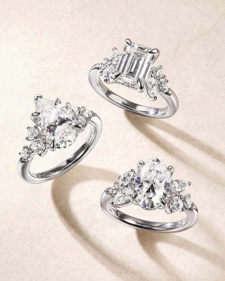 Three elegant diamond engagement rings featuring various cuts, displayed on a soft background. Visit Sather Jewelry for more.