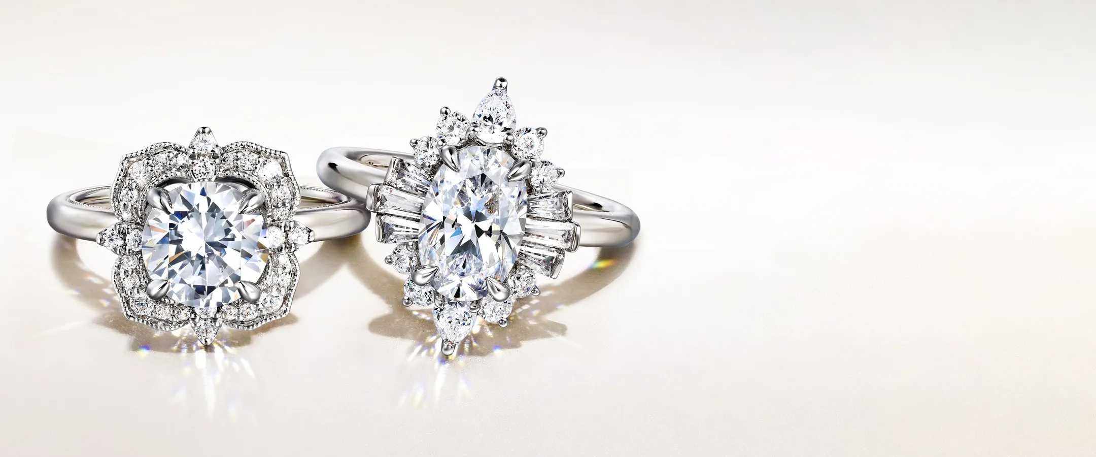 Two elegant engagement rings featuring intricate designs and sparkling diamonds, inviting you to make an appointment at Sather J