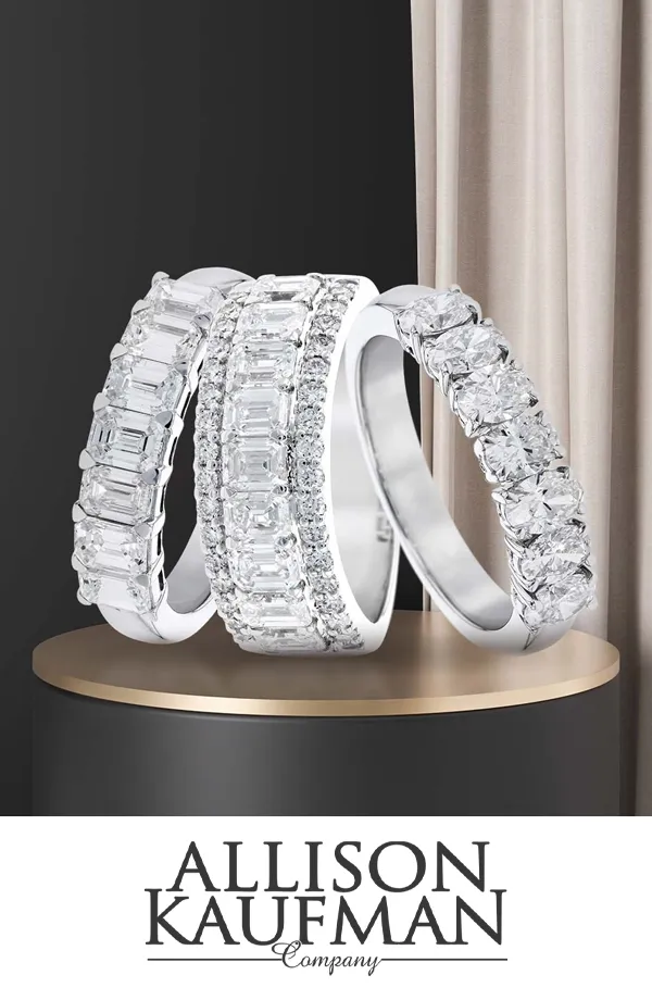Three elegant diamond rings displayed on a pedestal, featuring various cuts and styles.