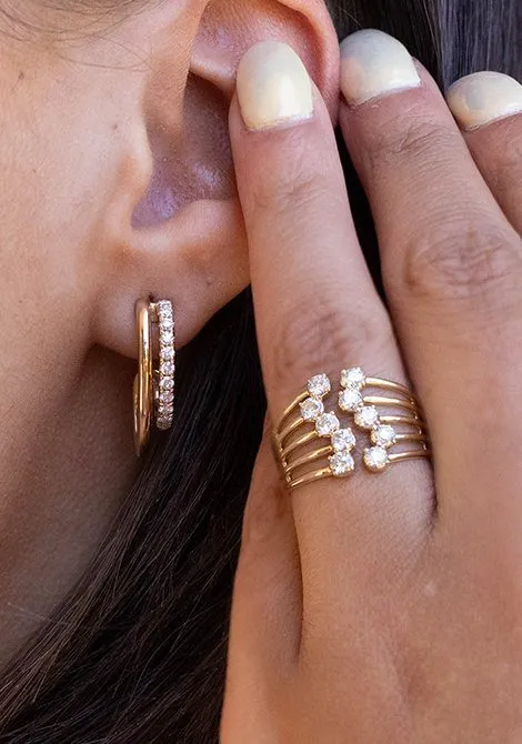 Diamond huggie earrings and a stacked diamond ring