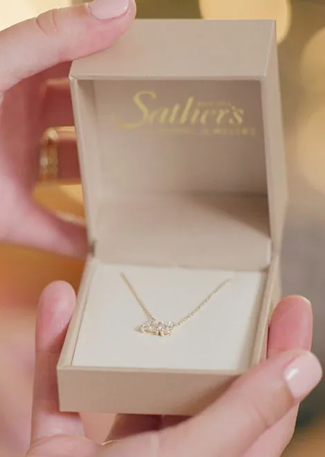 A diamond necklace in a Sather's gift box