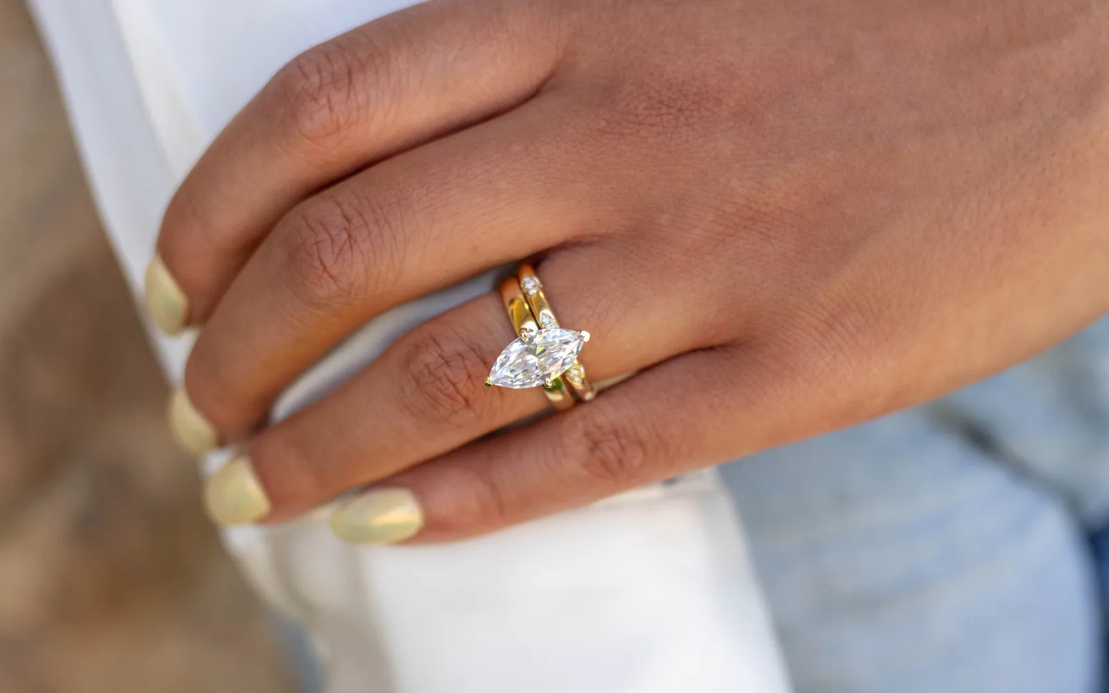 Elegant oval diamond ring with halo setting, showcasing unmatched craftsmanship. Visit Sather's Leading Jewelers for more.