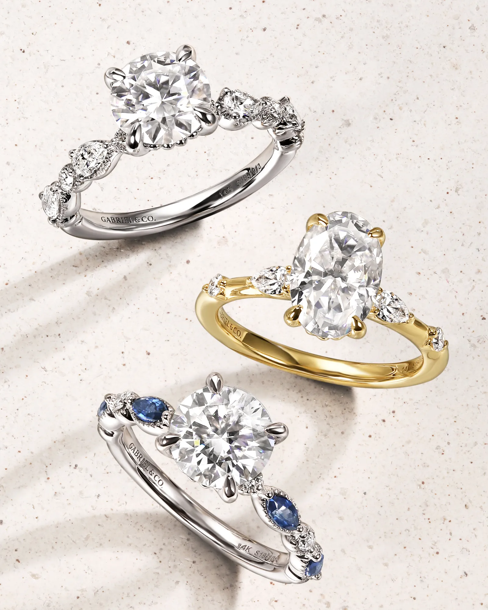Three elegant engagement rings from Gabriel & Co. in silver and gold settings. Click to browse more at Sather's Leading Jewelers