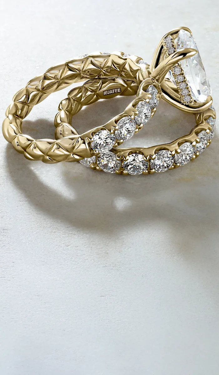 Elegant A. Jaffe gold engagement and wedding rings with diamonds.