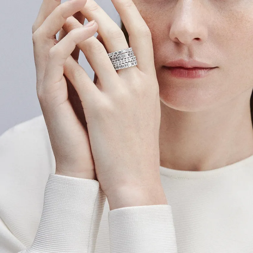 Model showcasing a stack of diamond rings.