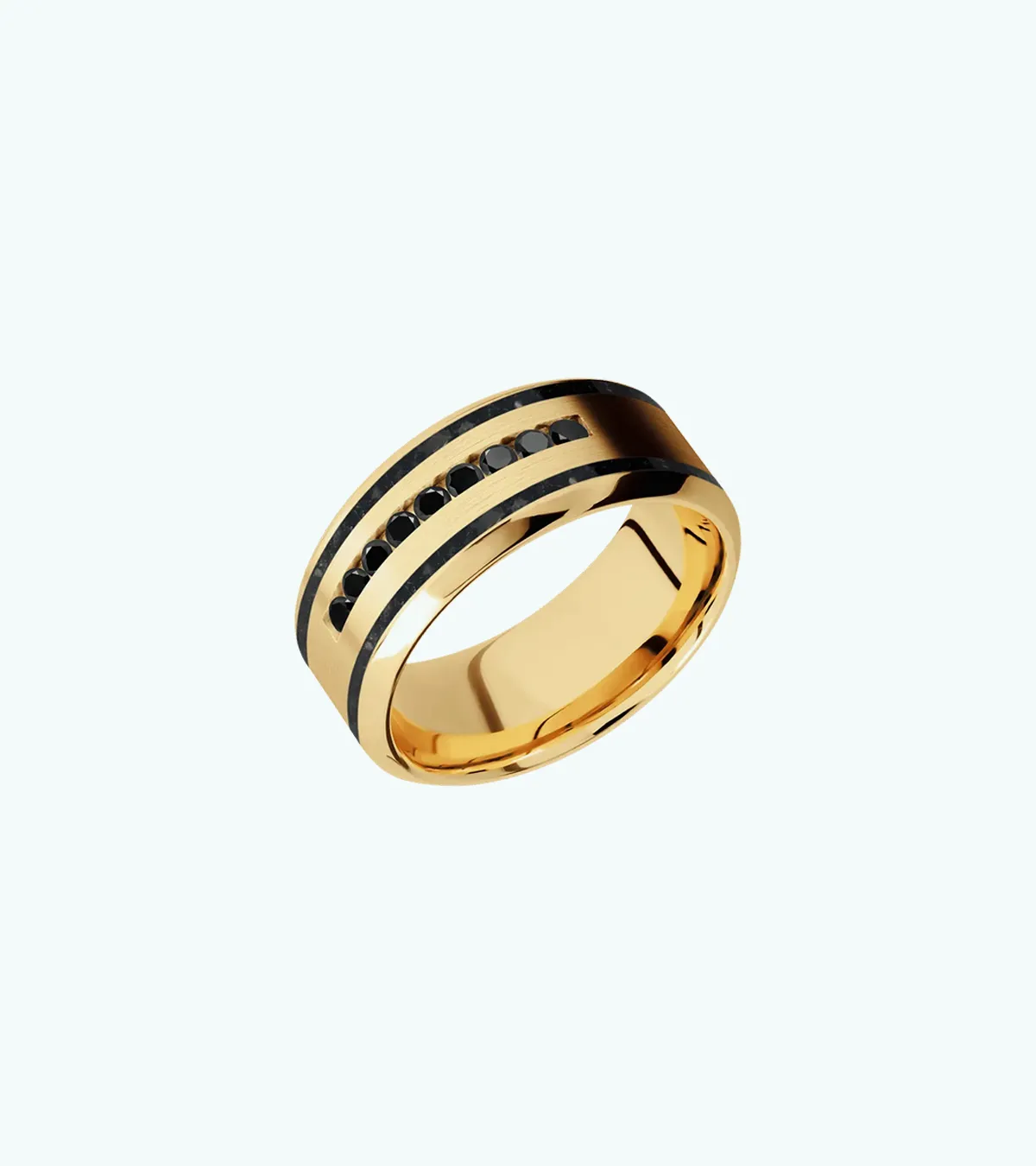 A gold men's wedding band with black stones set in a central groove.