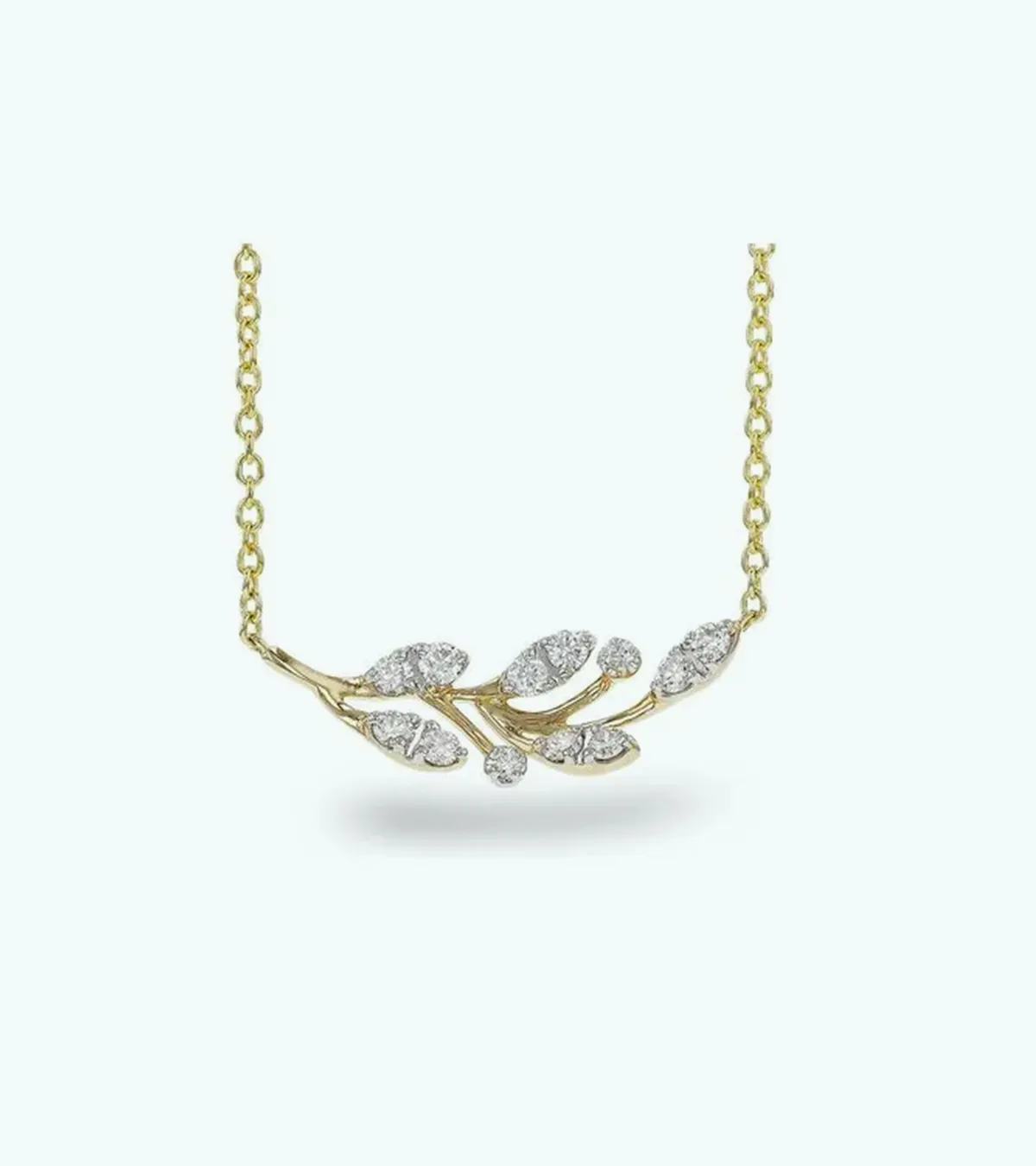 Gold necklace with diamond-accented leaf design on a delicate chain.